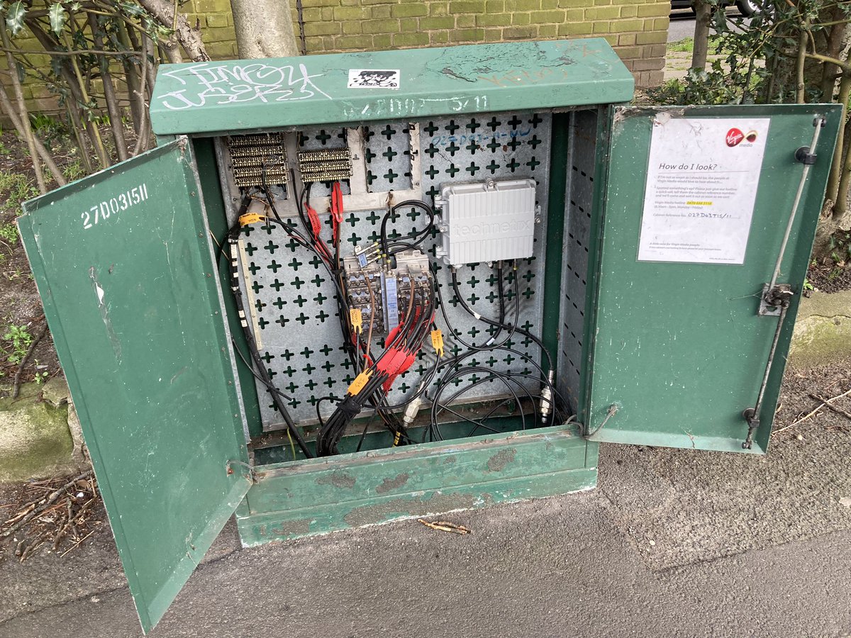 MathijsSwarte's tweet photo. @virginmedia This thing has been open/unlocked with the wiring exposed for months. I see loads of them open, all around London. Looks dangerous! Kids are playing around it every day. None of your phone numbers work! I can’t reach anyone at Virgin! Can this be sorted? https://t.co/FwPKgUqb4u