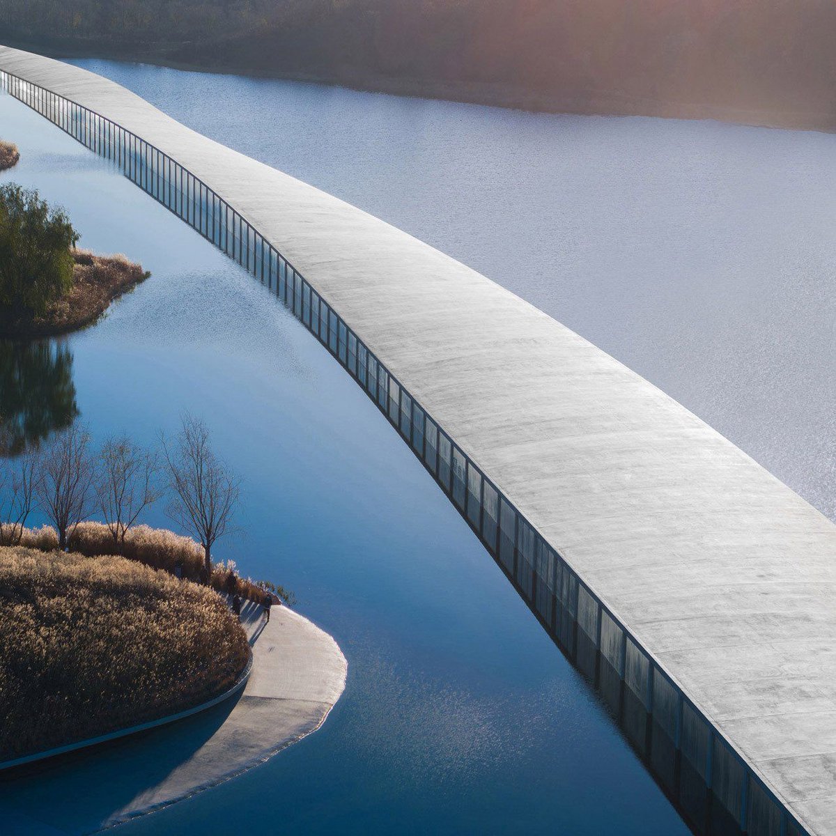 NWArchitect's tweet photo. Junya Ishigami reveals one-kilometre-long museum emerging from Chinese lake https://t.co/PKSCcLNuJi #design #architect #architecture https://t.co/XXoYiY6AhN