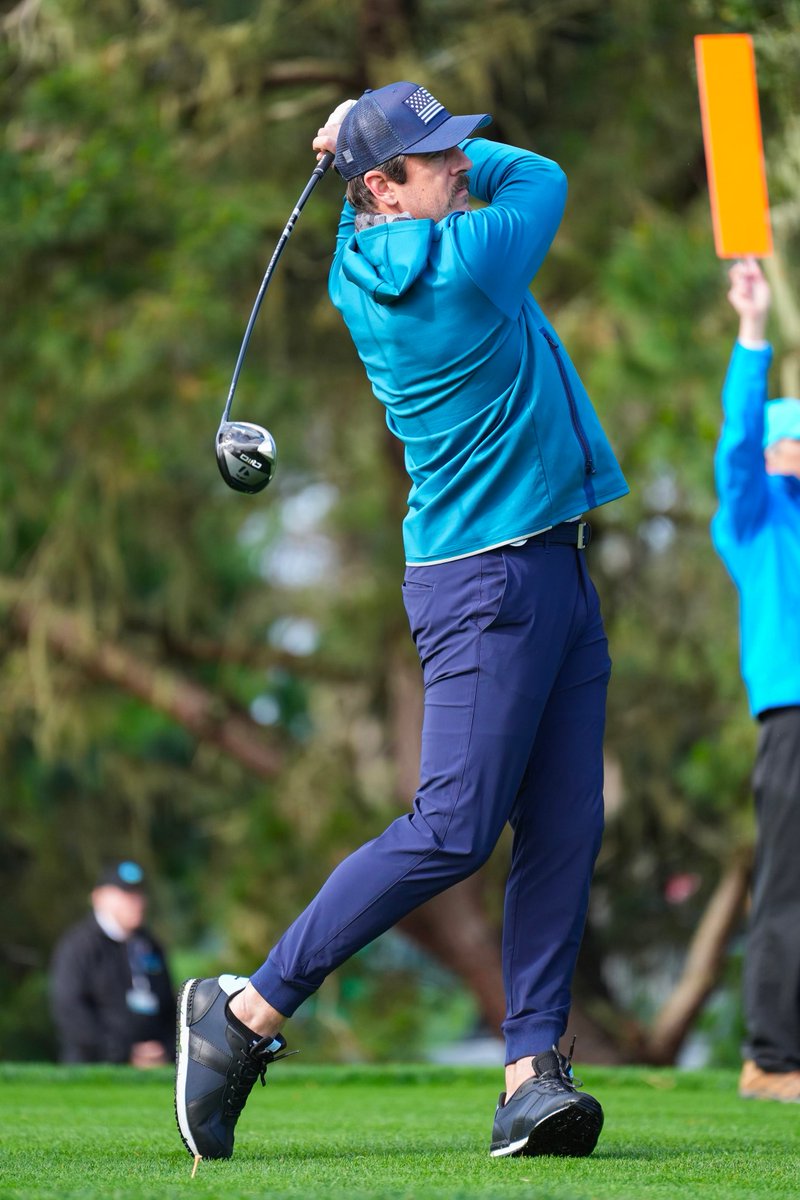 After being with @adidas for years.... Aaron Rodgers was spotted in a @GreysonClothier hoodie and a pair of their Coywolf shoes at Pebble Beach. 👀