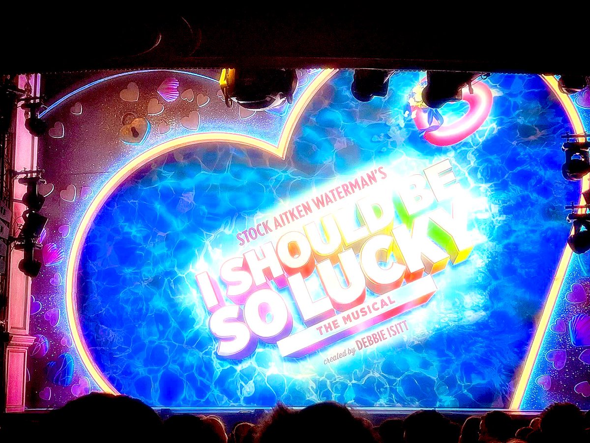 Kierbro's tweet image. Cracking night @SoLuckyMusical in Wimbledon (after we moved seats for act 2 anyway). So many amazing pals absolutely shining onstage - smiled &amp;amp; sang along (quietly!) the whole way through. Terrific fun - go see while you can - especially if you’re an 80’s kid! #TheHitFactory