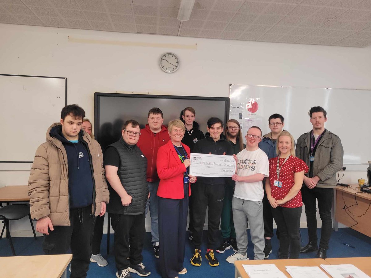 Lifeskills Plus A in Arbroath handing over their cheque to <a href="/DSScotland/">Down's Syndrome Scotland</a> 
Money raised was through an enterprise project.
