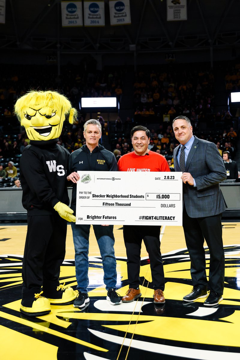 GoShockers's tweet photo. The standard has been set.

By tip-off at last year's @champsforlit game, we were able to present a check to @unitedwayplains for $15,000(!) that helped purchase books for @WichitaUSD259 students.

Help us exceed that amount this year.

Give now 👉 https://t.co/Ie1FlE6a43 https://t.co/S1SAtXDsnG