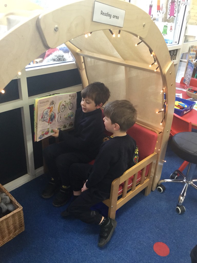EYFS - The children in Amethyst Class love sharing books together in our reading den