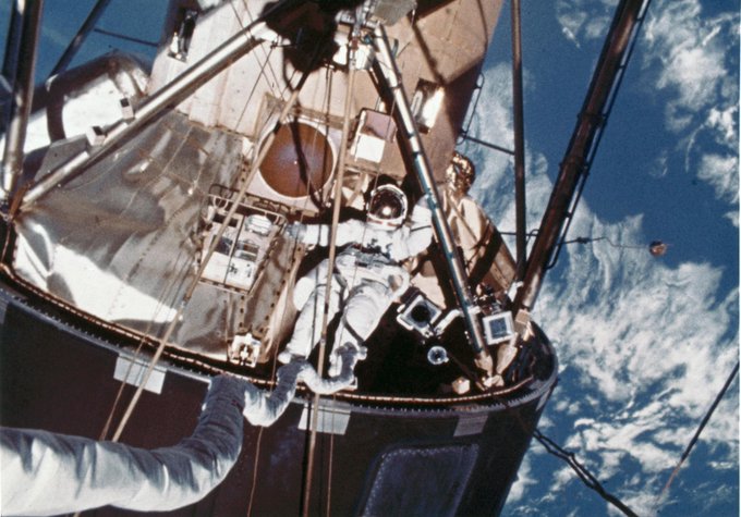S74-17456 (3 Feb. 1974) --- Scientist-astronaut Edward G. Gibson has just egressed the Skylab EVA hatchway in this frame taken from a roll of movie film exposed by a 16mm Maurer camera. Astronaut Gerald P. Carr, Skylab 4 commander, took this picture during the final Skylab extravehicular activity (EVA) which took place on Feb. 3, 1974. Carr was above on the Apollo Telescope Mount (ATM) when he shot this frame of Gibson. Note Carr's umbilical/tether line extending from inside the space station up toward the camera. Astronaut William R. Pogue, Skylab 4 pilot, remained inside the space station during the EVA by Carr and Gibson. Photo credit: NASA