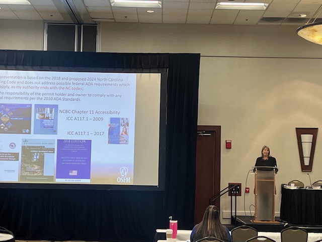 Tara Barthelmess, Chief Accessibility Code Consultant with NC DOI
 Tara helps the group come to a better understanding of relevant and current building codes and standards as they pertain to public facilities, parks and other recreation amenities. 

#ncprdc #FlashbackFriday