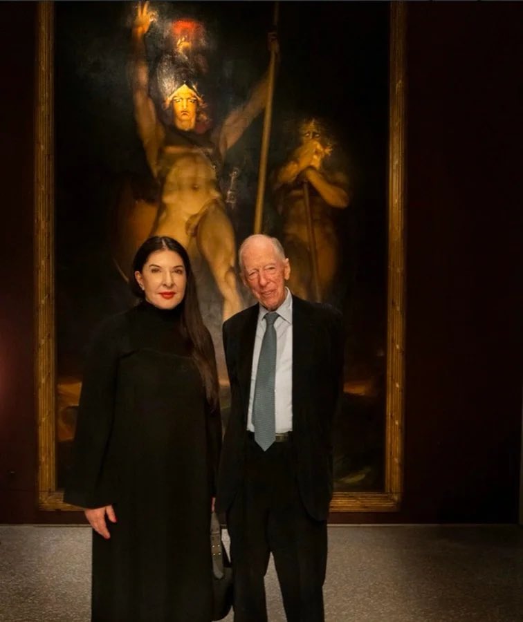 WarClandestine's tweet photo. The “spirit cooking” satanist witch that the Podestas were emailing, Marina Abramović, she is also close friends with Zelensky.

He recently appointed her as an ambassador to assist in the rebuilding of schools in Ukraine.

The lady who writes creepy messages in blood/shit/semen/breast milk on the walls and glorifies violence against children in her “art”… Zelensky decided to put her in charge of children’s facilities in Ukraine… 

The same lady who hangs out with notorious child traffickers and pedophiles, John and Tony Podesta. 

The same lady who hangs out with Jacob Rothschild and poses in front of famous painting “Satan Summoning His Legions”.

The truth is worse than you can imagine.