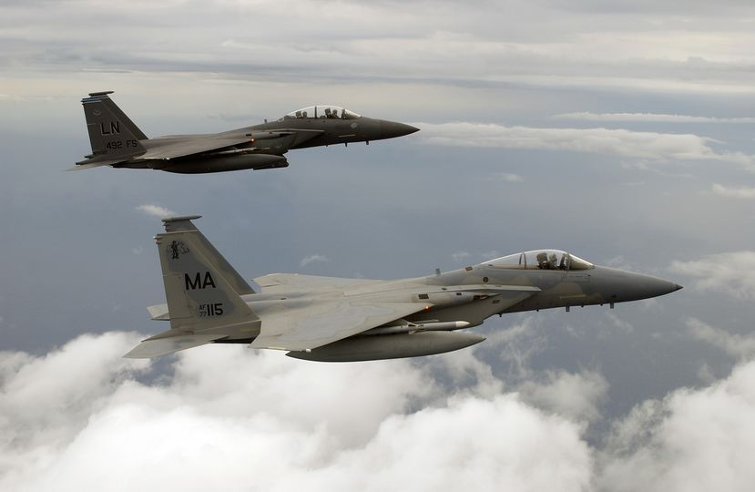 'Formation Friday' a rare combination. A Massachusetts ANG Eagle (77-0155) from the 101st Fighter Squadron, and an F-15E Strike Eagle from the 492nd Fighter Squadron, RAFLakenheath, England,  in formation over the Gulf of Mexico  on Feb. 24, 2005. (Photo by Msgt. Michael Ammons)