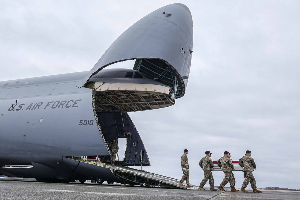 Dover Air Force Base carry team transfers the remains of United States Army Sgt. WILLIAM RIVERS of Willingboro, N.J. from C-5 Galaxy aircraft to a transport vehicle, during a dignified transfer at Dover Air Force Base Friday, Feb. 02, 2024, in Dover, DE.