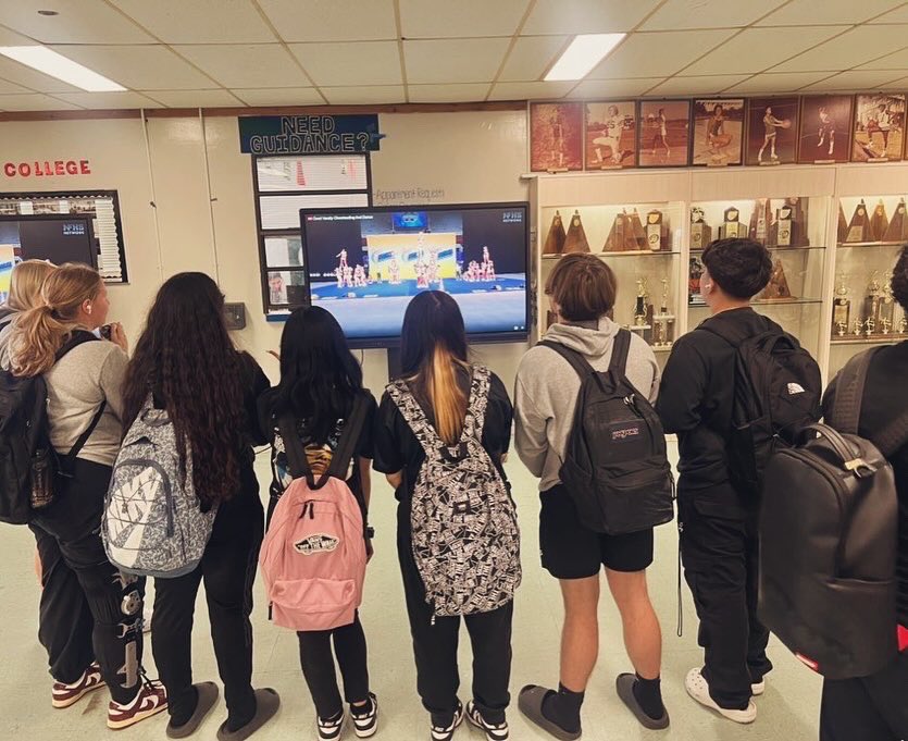 🎉When your cheerleaders make it to states but you can’t go, you bring states to you! 💥During lunch, students watched our cheer team compete on live tv and showed their support from afar! #ColtsUnited indeed! 📣 💚💙
