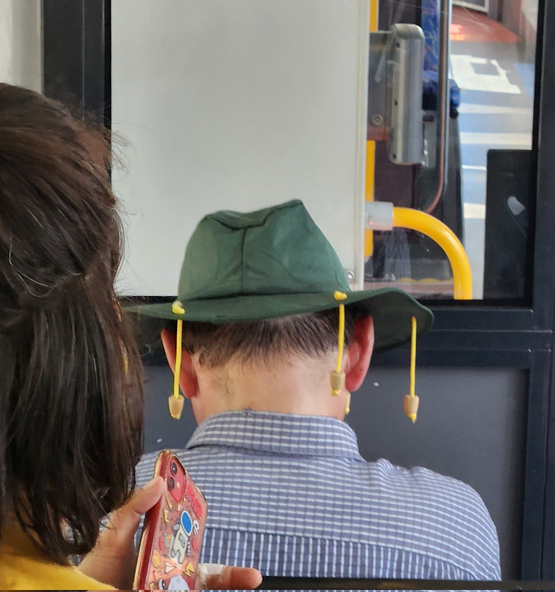 First real life sighting of a hat with dangly corks on a bus today #Australia