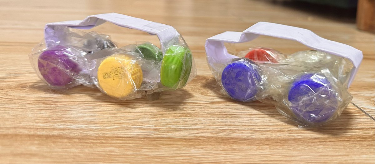 ralmond2021's tweet photo. My son looks at cars on the road and returns home everyday to coil cars out of papers. He has a very big fleet with different cars and can name each one of them. Now he has added Wheels to the cars using bottle covers. Very innovative young, https://t.co/mcqga9xSK4