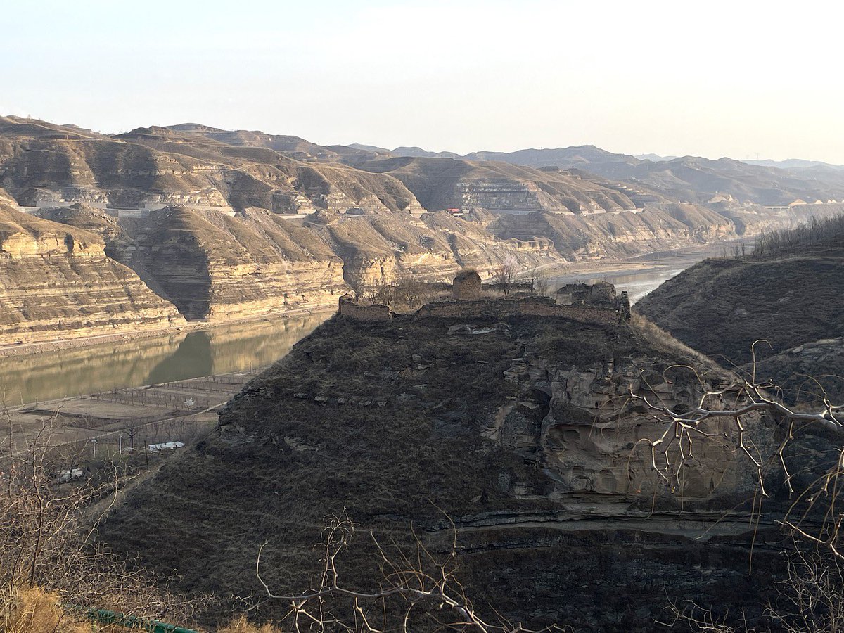 “Time is a wall. Maybe life is too. I walk onward with my Chinese walking partners.” —@PaulSalopek Read Paul’s latest dispatch: outofedenwalk.nationalgeographic.org/articles/2024-… Pictured: The walled ruins of a Ming dynasty temple loom over the Yellow River near the village of Mahuaping, central China.