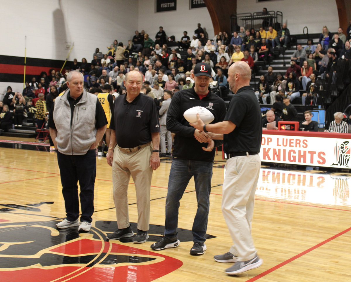 Last night, athletic director Kevin Mann presented @CoachKLindsay and former head coaches Steve Keefer and Matt Lindsay with the game ball celebrating the program’s 500th win that occurred last fall. #LuersSpirit