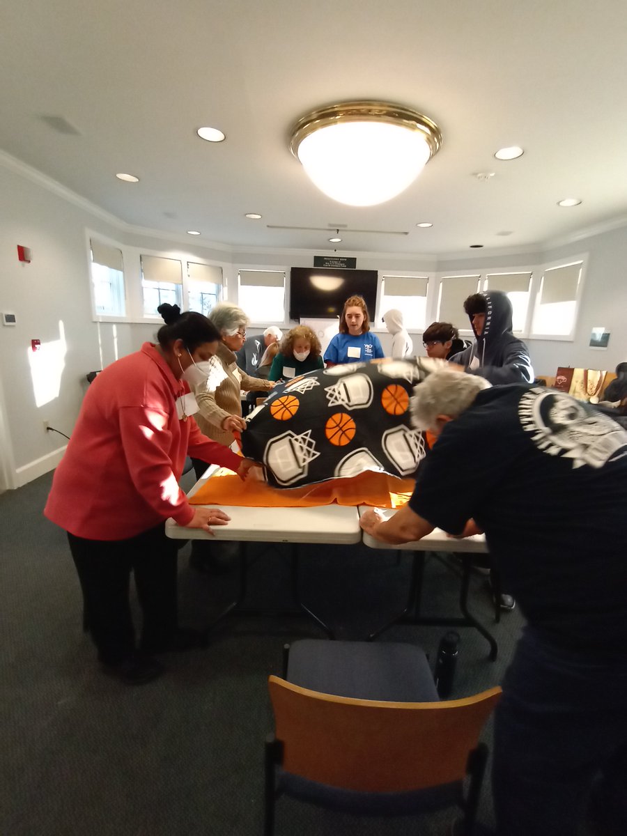 Intergenerational volunteers came together at the Pelham Town Library to make blankets for families in need. They enjoyed camaraderie and lively conversation.