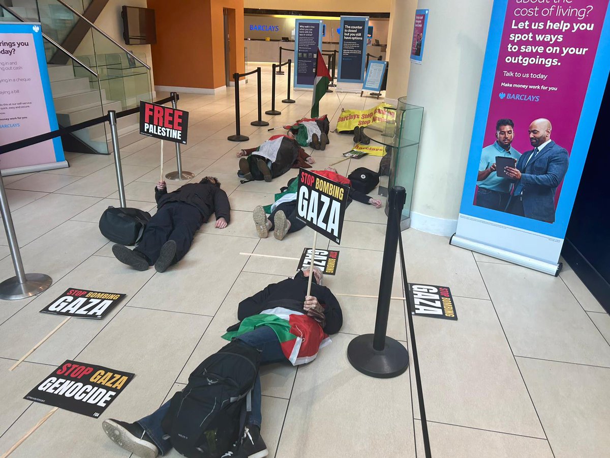 Die-in at Birmingham Barclays bank today. Activists shut it down this morning ahead of a rally and march. Well done all involved.