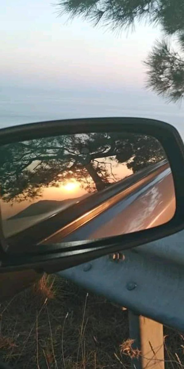 As the sun dips low, casting its fiery glow in my rearview mirror, a wave of peace washes over me. Good evening, all! Wishing you a night of tranquility ✨ #sunsetvibes #peaceofmind