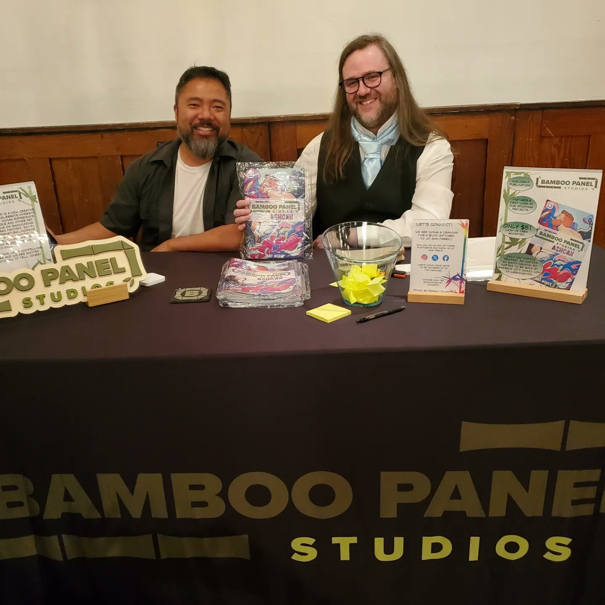BambooPanel's tweet photo. Our first tabling event at the Siouxper Snow Ball was a blast!  It was so fun to sell our Ashcan Preview issue celebrating our two upcoming books.  Shout out to SiouxperCon coming up in September.  The SF Sanderson Sisters joined the party and Randy got his color print signed! https://t.co/RzbxHu5K1o