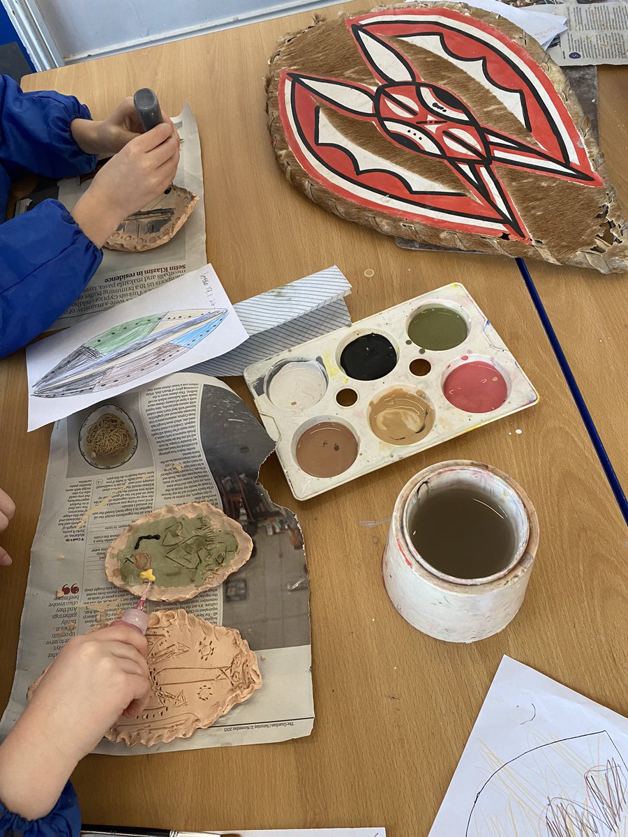 Year 2 ceramic workshop. Painting with underglazes the Masai shields made last week. Shiny results after final firing next week! <a href="/CastleNewnham/">Castle Newnham</a>