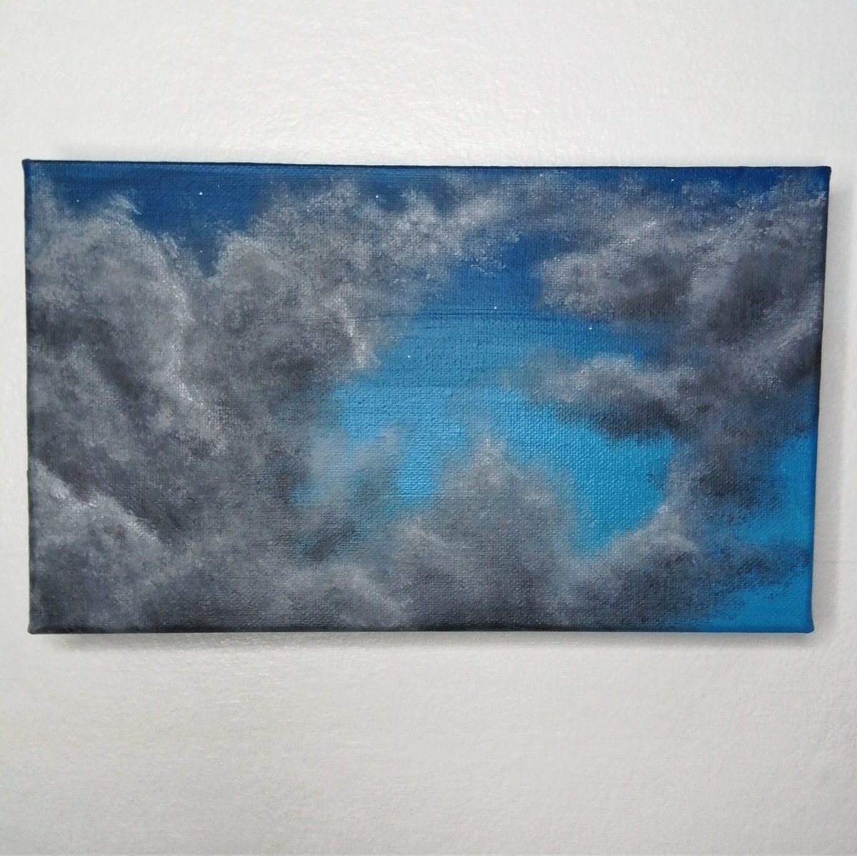 dawnroseart's tweet photo. I didn't really have a plan as I started painting this. 
I love the formation in the clouds and how the hole in the centre gives a peek to the stars that have started to shine. It gives a glimpse of the darkening sky before the clouds take over.
#happyart #clouds #ArtistOnTwitter https://t.co/YM6DWOXQBt