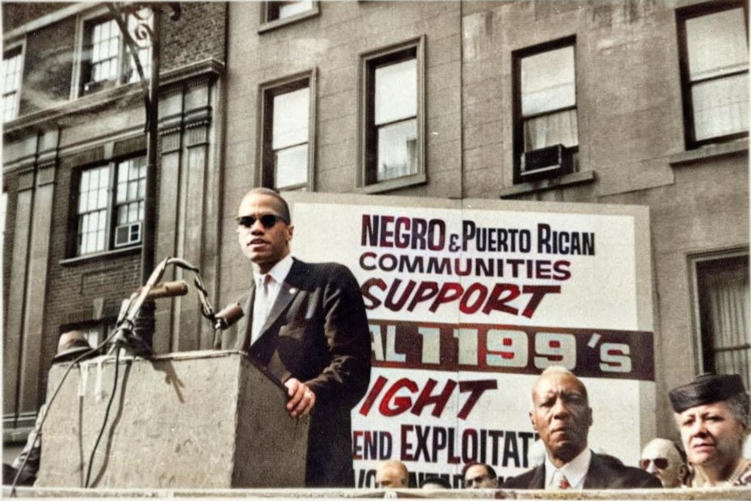 UnionDrip's tweet photo. Malcolm X speaking at a rally in support of Leon Davis, SEIU Local 1199 president, who spent 30 days in jail rather than comply with a court order to call off a 56-day strike. 

Seated on his right are A. Philip Randolph and Anna Arnold Hedgeman. #BlackHistoryMonth https://t.co/PiiaQTkbvn