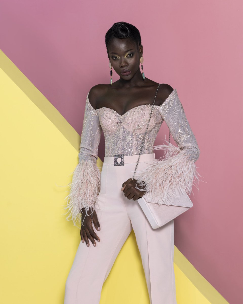 najasaade's tweet photo. A word of glitz and attraction in this light pink off-shoulder jumpsuit featuring an embroidered top with feather accents at the end of the sleeves, paired with crepe pants.

From “Life in Colors” Naja Saade’s Ready-To-Wear Spring Summer 2024 collection. https://t.co/NYg8xAzO4l