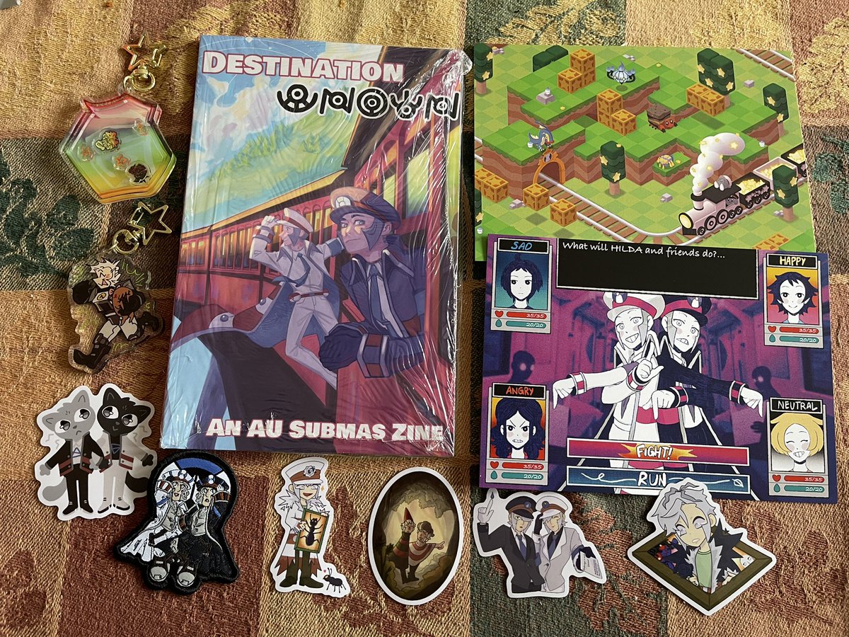 The train has arrived at the station! Thank you <a href="/destunownzine/">Destination UNOWN: An AU SubMas Zine!</a> for this fantastic zine! All the merch is so great and can’t wait to read through the zine!!!