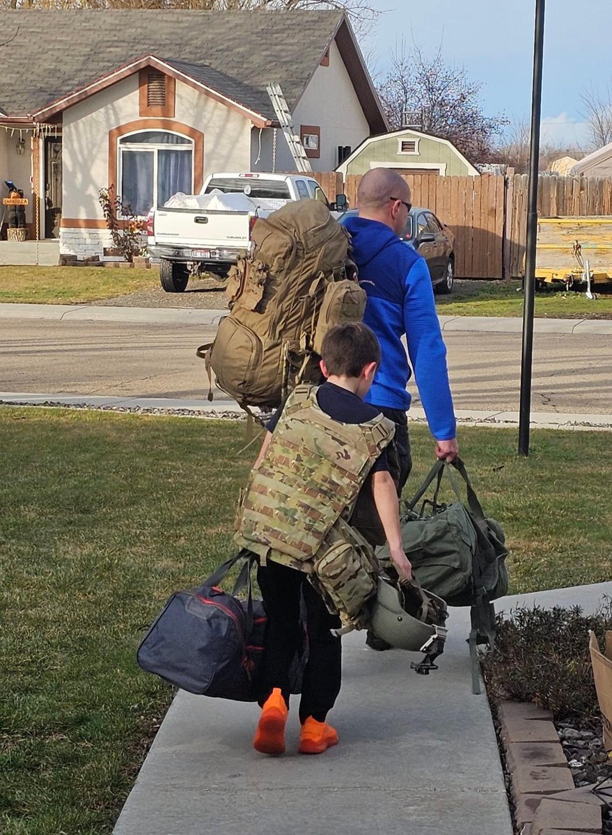 LOAD UP: Zander helps his dad, 1st Sgt. Zane Simmons, prepare for drill weekend with his unit, A Company, 116th Brigade Engineer Battalion.