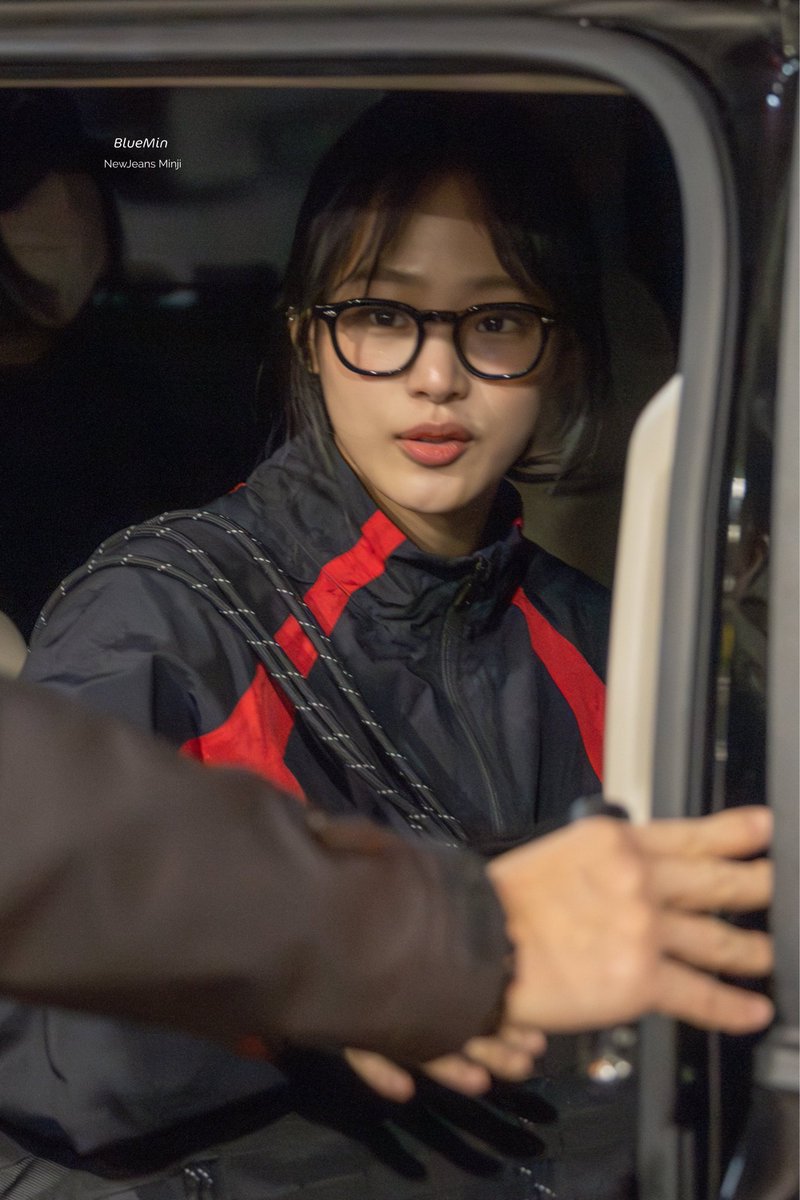 minjamante's tweet image. Minji wearing her moscot glasses
