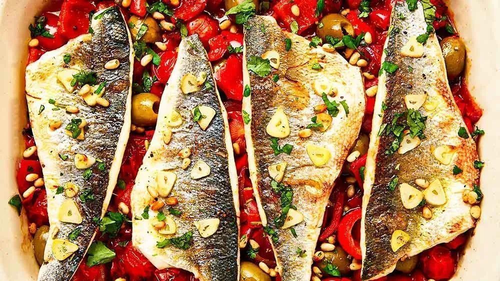 This sea bass tray bake recipe requires very little preparation but it is packed with flavour and can feed the whole family at supper time. Details here: buff.ly/3Xzv0aR #crouchend #muswellhill #fishmonger