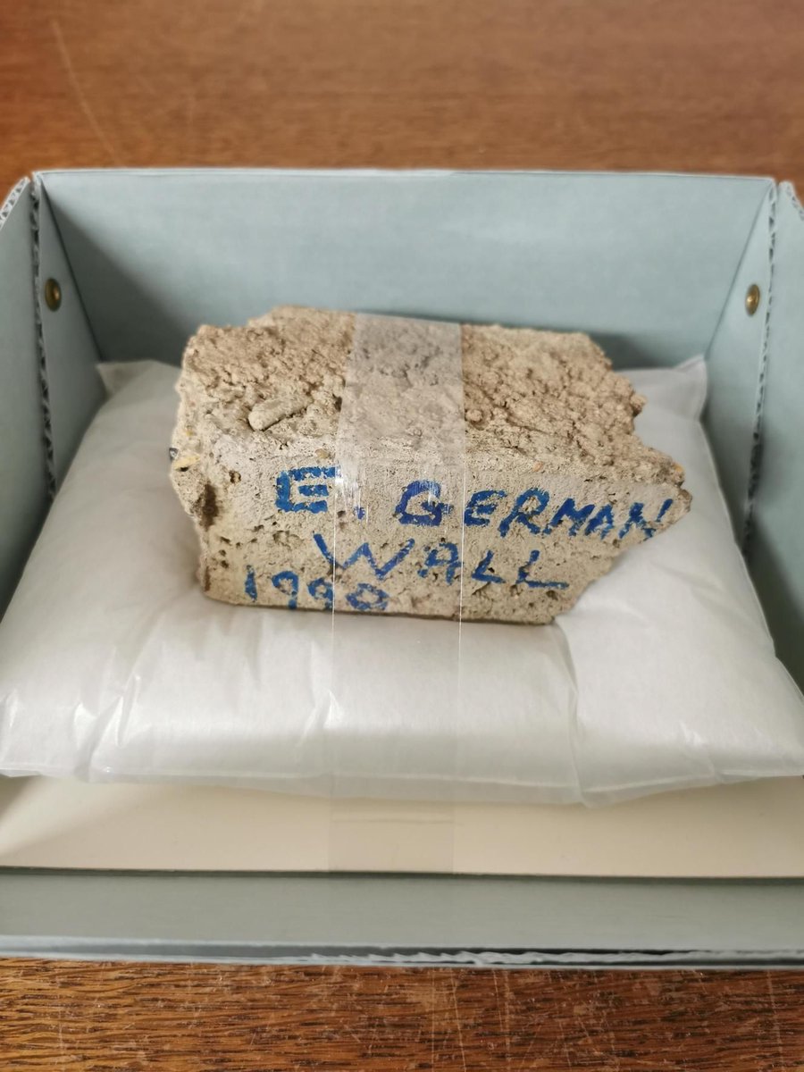ChuArchives's tweet photo. Today's artefact from the archives: a chunk of the Berlin Wall, hammered off a section that was still standing in late 1990. #AC50 https://t.co/6E9LongS8R