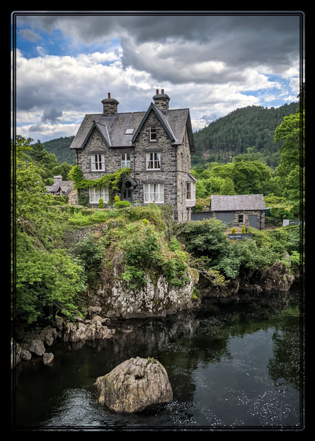 A #Guesthouse on the #river. Shot on #location from #Pont-y-Pair #Bridge in #BetwsyCoed by the @photos_dsmith team. The views of #eryri #NorthWales and @visit_snowdonia are #spectacular in this part of the #world. #landscapephotography @visitwales #photography #outdoors #Scenery