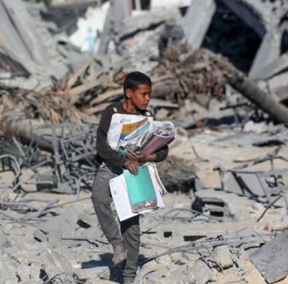 THIS BOY WENT TO SAVE HIS BOOKS AFTER ISRAEL BLEW UP HIS SCHOOL