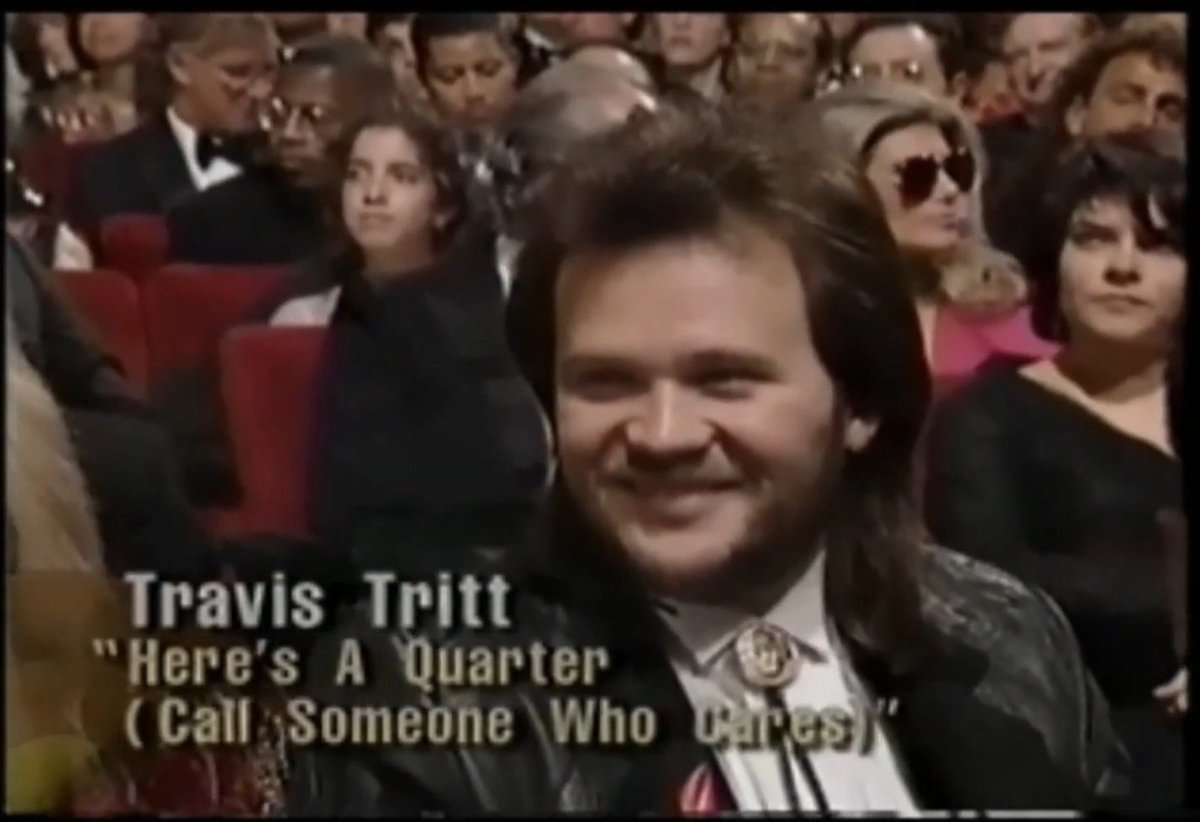 Since @RecordingAcad are on TV tonight, here are two screenshots of @Travistritt at 'The 34th Annual Grammy Awards', aired on February 25, 1992, four days before he joined the @opry and became a member. The woman with blonde hair next to him is his girlfriend, Malysa Wise.
