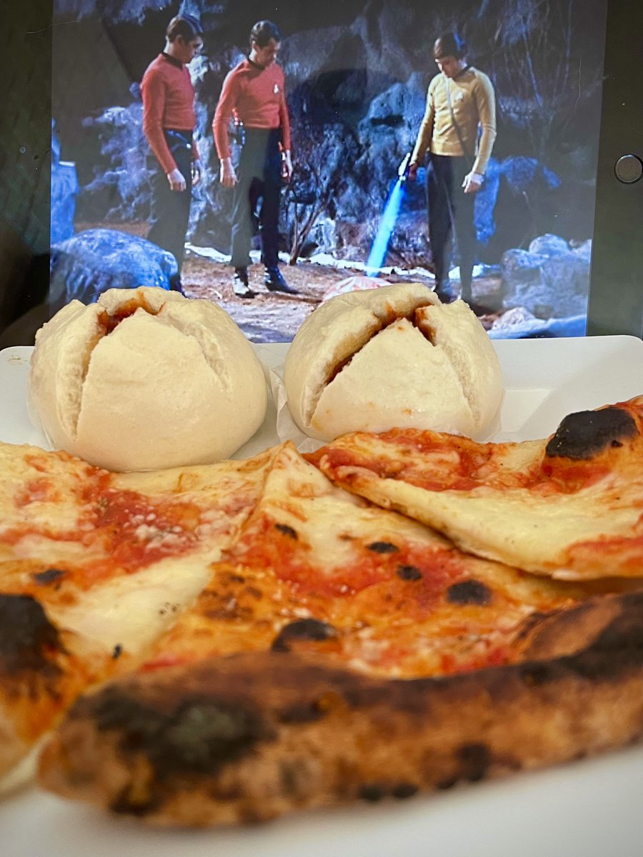 Star Trek with leftover margarita pizza and heating up my steamed pork buns. Apparently a low stun setting is used to heat things. I always thought there was a specific setting for heat