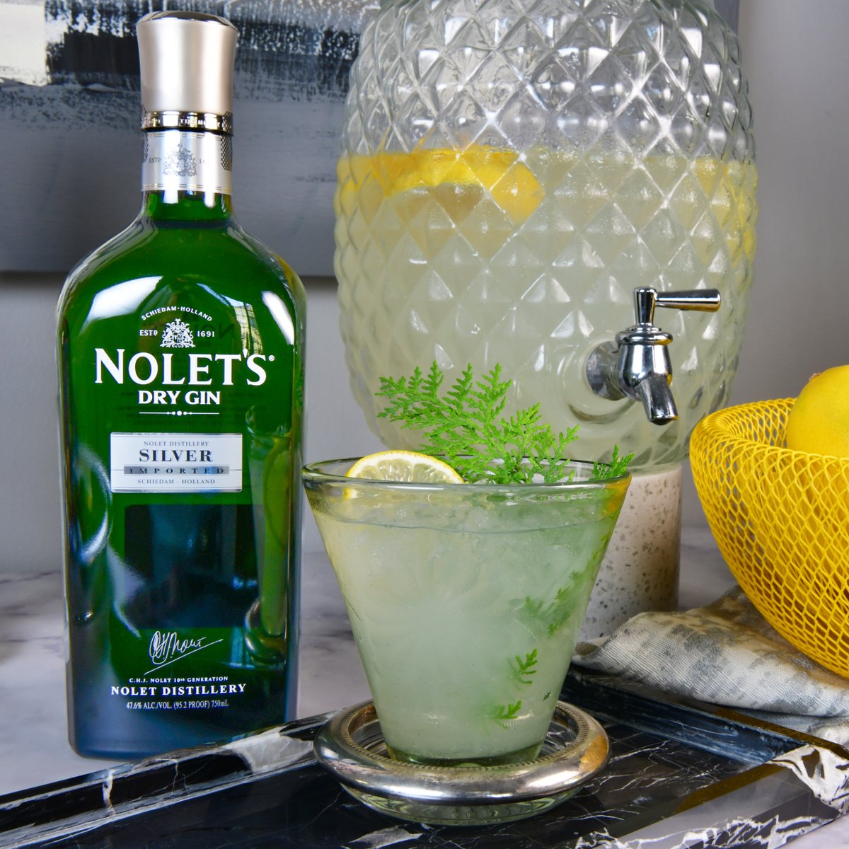 It's NOLET'S Winter Lemonade Szn. THE crowd-pleasing, make-ahead, luxury lemonade we enjoy all through Meyer lemon season. #WinterLemonade #Meyerlemonszn #NOLETS #NoletsGO #SuperBowl #Grammys #BatchedCocktailRecipe #WinterCocktail #Gin #SeasonalCocktails