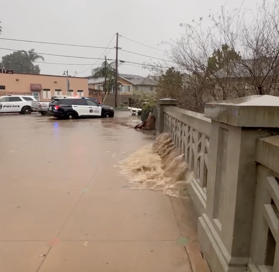 Sunday evening the mountain rain runoff took Mission Creek in Santa Barbara to its limits around Haley St.  But the rain backed down and so did the creek level.  Many residents in the area were alerted.  (Photo: Santa Barbara Police).