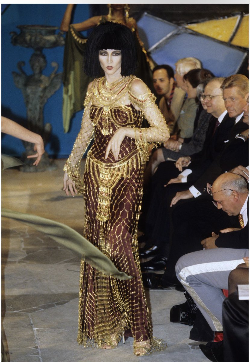 Miley Cyrus in custom Maison Margiela. John Galliano referenced his own gold  safety-pin dress from Fall 1997