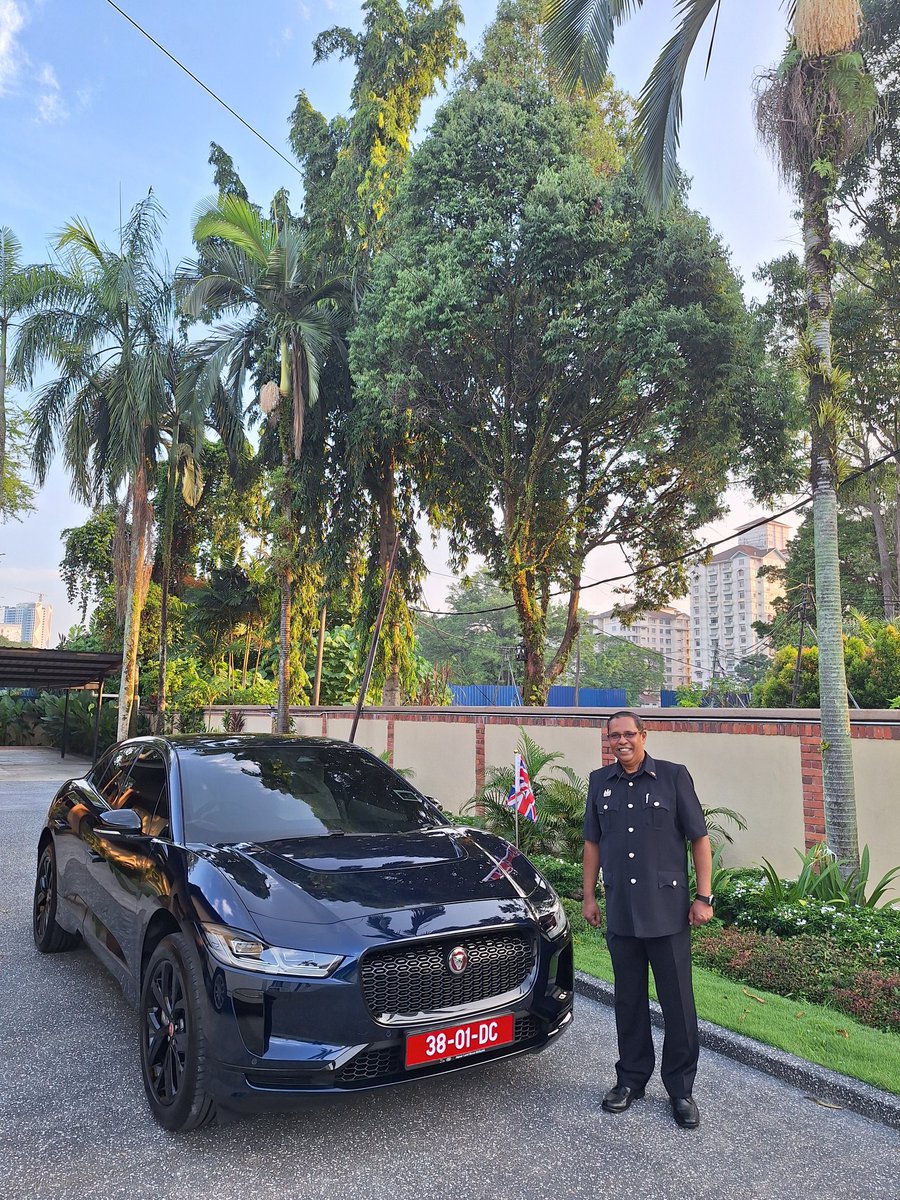TerryAilsa's tweet photo. A great start to the week: we have a new &amp; completely electric Jaguar flag car 💚🇬🇧 .

Pictured here with my brilliant driver (and first class bahasa teacher) Deen! https://t.co/gW7a4q2lRJ