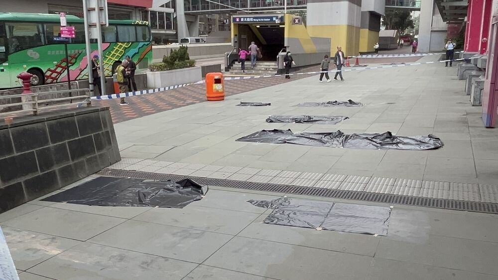 tomgrundy's tweet photo. #NormalCity: Photos from Sing Tao show multiple officers responding to a "national security alarm" after illegal "Liberate Hong Kong, revolution of our times" slogans appeared on a Wong Tai Sin path.
Turns out the paint covering them since the 2019 demos had worn off. https://t.co/5SoaWOJH26
