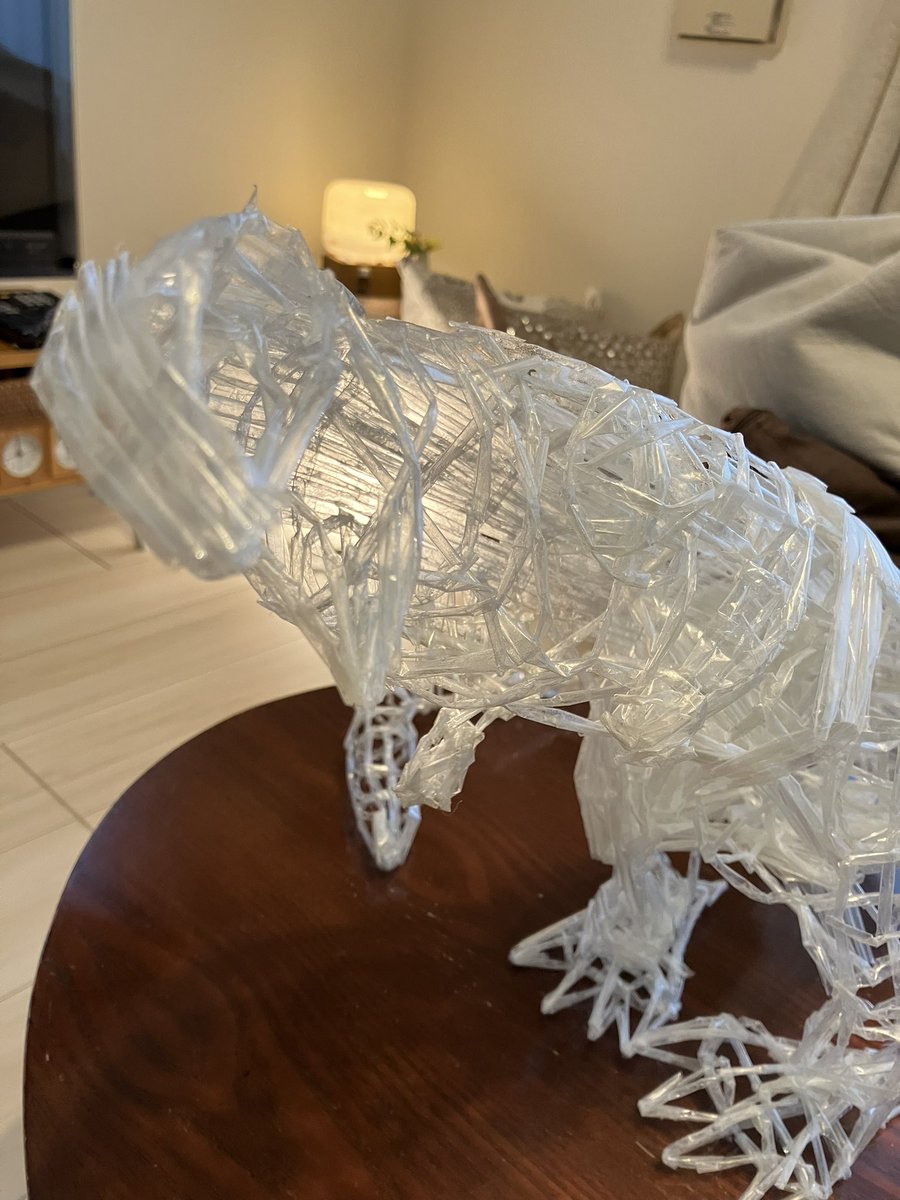 My son is crafting #Godzilla using only #adhesivetape  He has completed the framework and has now begun adding details, such as the muscles on the legs, covered with molded tape resembling thin straws. I look forward to seeing the completed project! #art