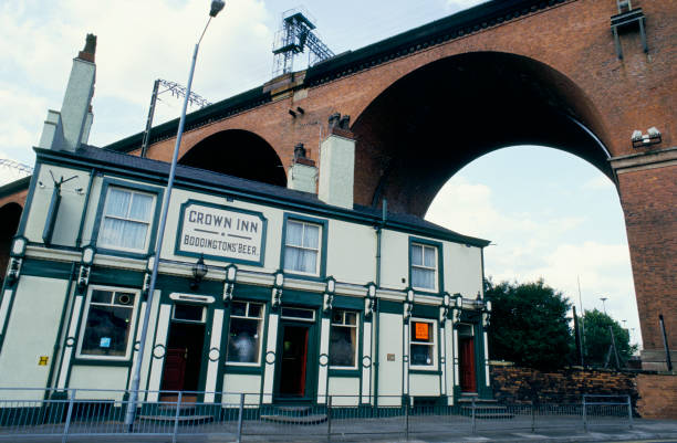 McrHistory's tweet photo. The Crown Inn pub in Heaton Lane under the arches of  Stockport Viaduct. Photo from 1993. 

The Crown Inn was originally built as three terraced houses, then remodeled into a pub... https://t.co/03gIbAAXfw