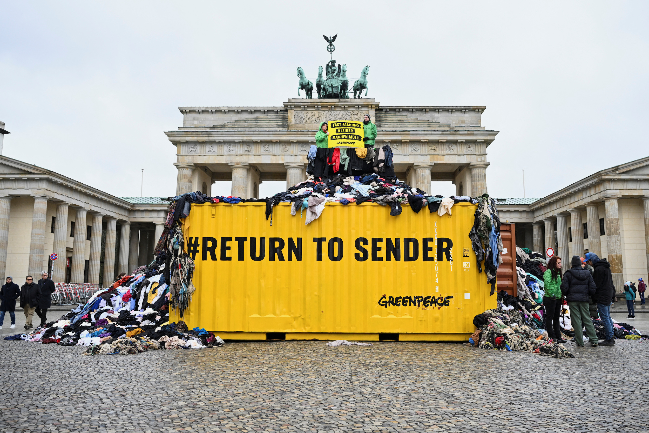 TRT World Now on X: "In pictures: Greenpeace activists protest on first day  of Berlin Fashion Week with textile waste from second-hand market  https://t.co/Lr0koe36ef" / X