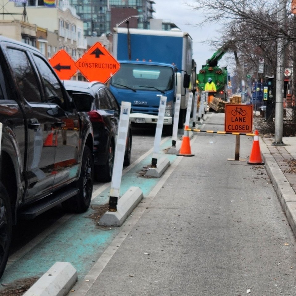 Danforth bike lane closed westbound just after Gledhill.

Nice 90° turn between curbs, across the parking lane, and into traffic. No signage telling drivers to expect merging cyclists. No single file signs.

We really, really, need to stop letting this stuff happen <a href="/311Toronto/">311 Toronto</a>