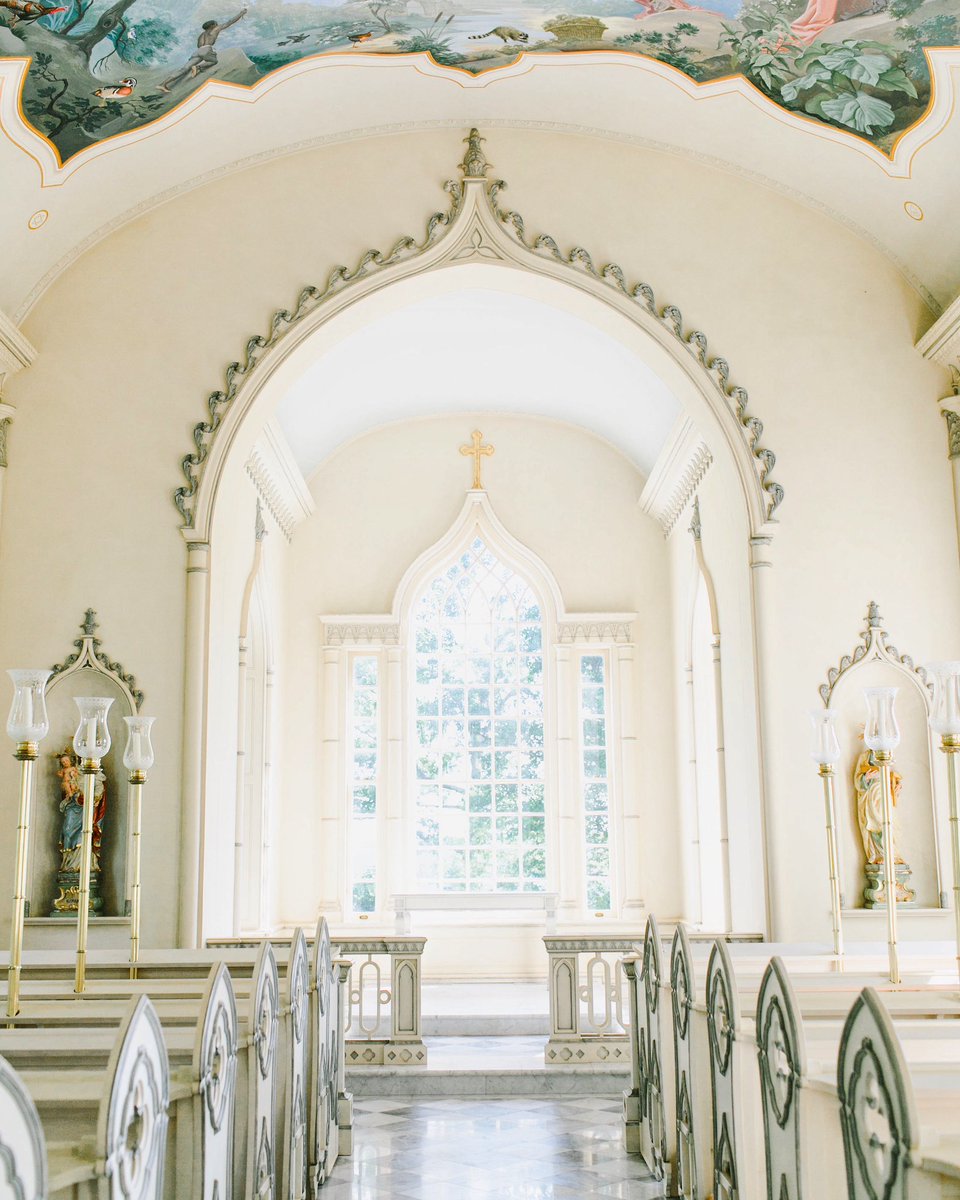 Boasting checkerboard marble floors, leaded glass windows, and a hand-painted mural ceiling, the chapel at Albemarle Estate serves as the perfect setting for unforgettable wedding ceremonies.