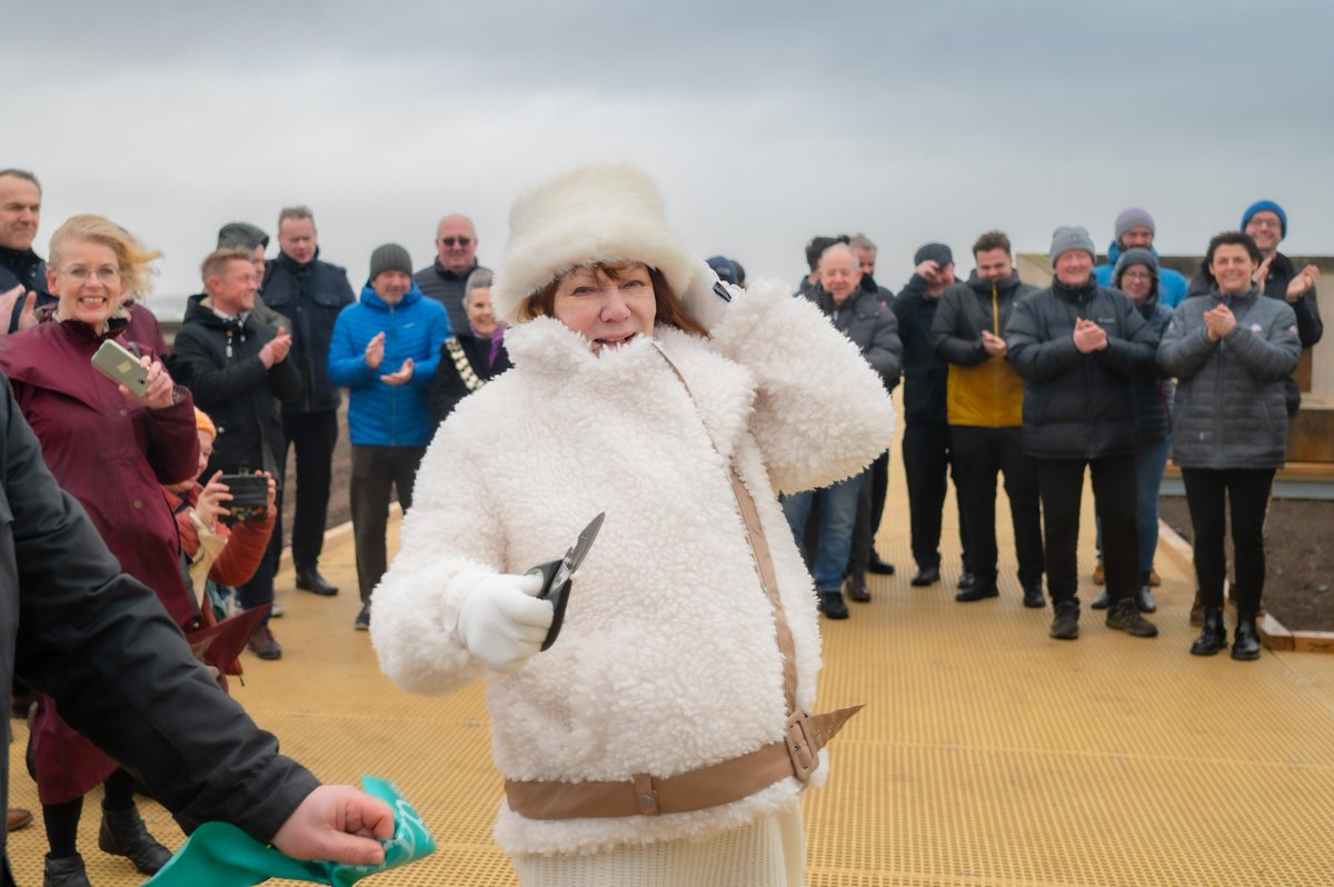 CumberlandCoun's tweet photo. Maryport’s new Boardwalk, which links two key destinations in the town, is now officially open to the public.

Dozens of people braved wind and rain to mark the occasion, with Councillor Carni McCarron-Holmes, Chair of Cumberland Council, cutting the ribbon today (Monday 5 February). The new stretch of accessible pathway joins the town’s promenade and harbourside, crossing the sandy area known locally as La’al Harbour.

The Boardwalk is part of the transformation of Maryport’s public realm using money from the Government’s Future High Streets Fund.

Cowran Estates Services Ltd, based in Ulverston, was the main contractor and used the skills of local subcontractors to complete the project.

Photo courtesy of Tom Kay

#WeAreCumberland #Regeneration #Maryport