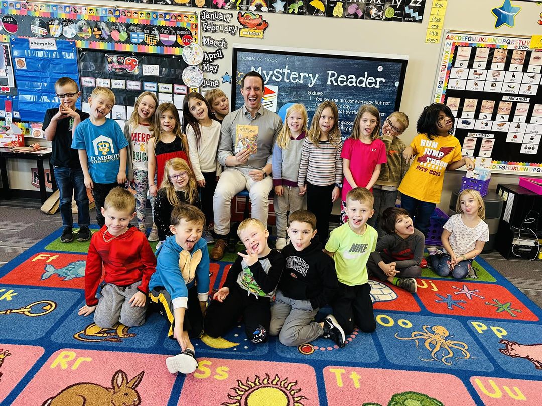 FEBRUARY is “I Love to Read Month!” Mrs. Yolch &amp; Mrs. English’s class kicked it off with Principal Josh Westphal as their first Mystery Reader! They will be having surprise readers all month long.