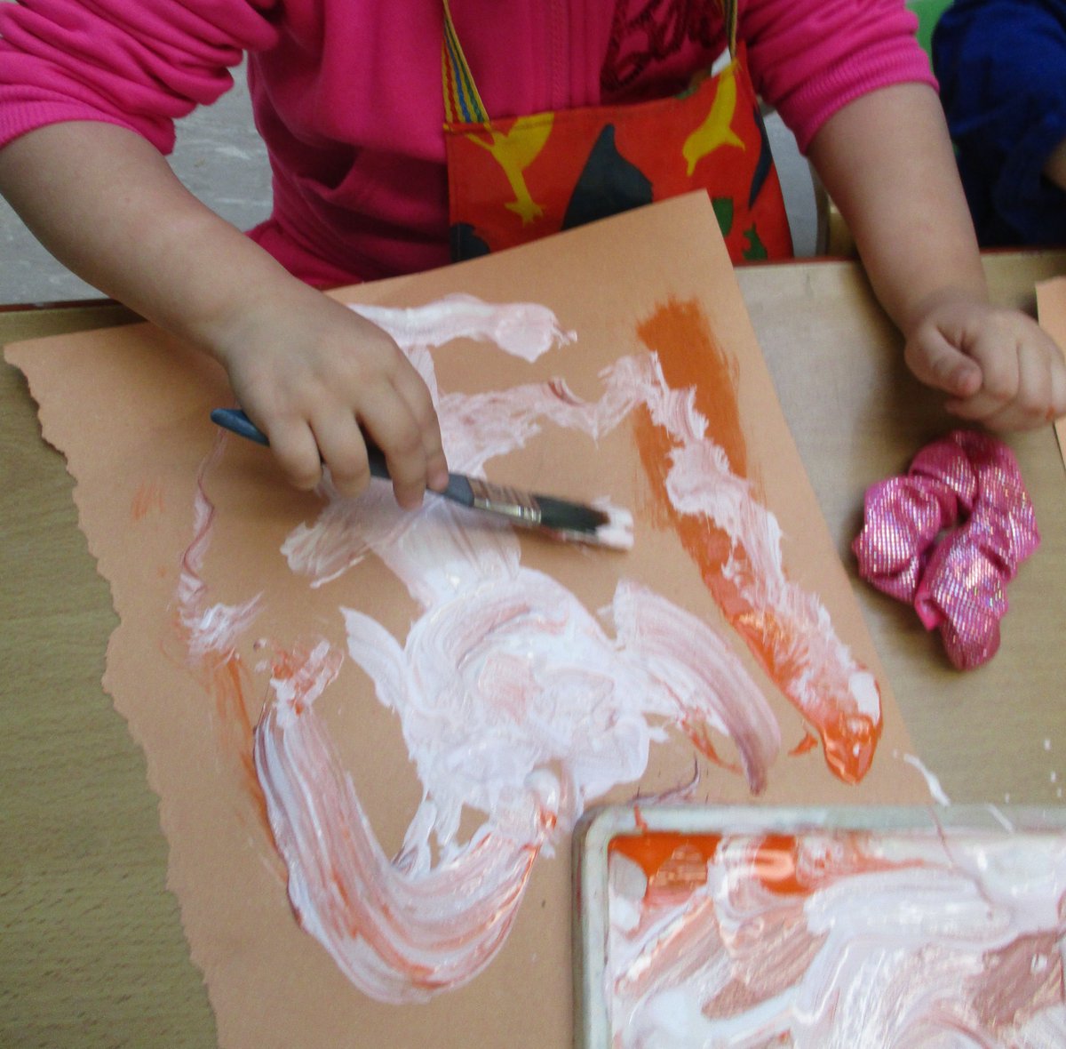 Children loved painting self-portraits.
"My face, my eyes blue, my ear, my hair, me."
"My face is round. My hair is brown. My eyes are brown."
"My big smile."
"That's me. This is my eyes. That's my mouth. I'm happy."
"Eyes, legs, colours,"