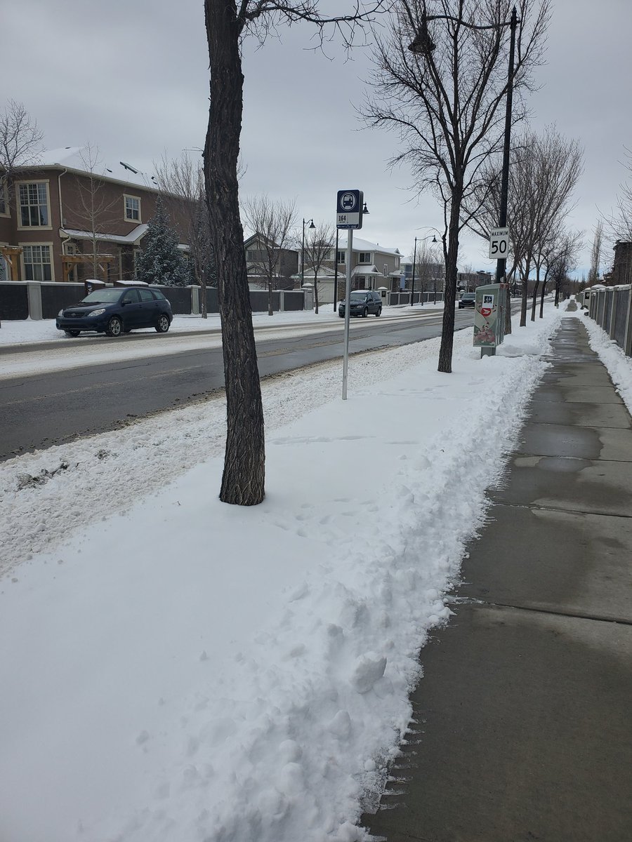 ShaneTMark's tweet photo. Not a ton of snow this year, but this is happening again. Streets get scraped but piled up into bus stops making it hard to get to @calgarytransit Should getting on the bus be difficult? Think of someone with limited mobility or pushing a stroller. #yycroads #calgarytransit #yyc https://t.co/A44yHFbXoQ