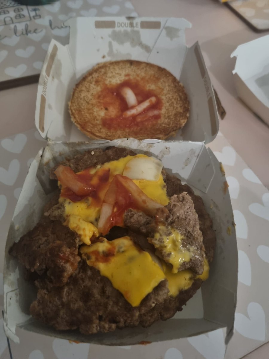 AndyMc147's tweet photo. @McDonalds what a joke this is, looks like burger been dropped on floor and still served up, couldn't risk eating it.  How difficult is it for staff nowadays to understand food hygiene, if I got this in store would go straight back up but it was a McDelivery but box was in shape https://t.co/W2WfuHVHI9