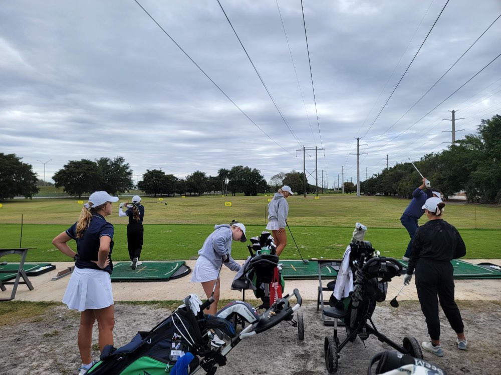 Girl’s and Boy’s Golf Team warming up for the exhibition match against St. Thomas. Go Gyrenes!